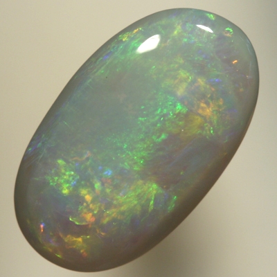 SOLID SEMI BLACK OPAL Orange and green move bright in rolling flashes